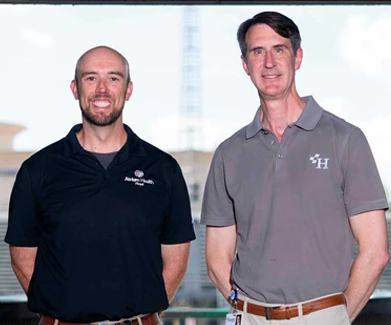 Two men standing in stadium 