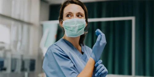 Provider wearing mask and gloves.