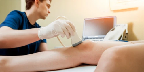 Ultrasound tech scanning a knee.